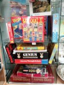 3 shelves of jigsaws & games etc.