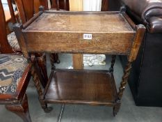 A 1930's oak tea trolley with drawer on barley twist legs COLLECT ONLY