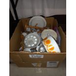 A large box of kitchen items including Pyrosil orange lidded tureens etc.