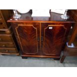 A dark wood stained 2 door cupboard with inner drawer. 79cm x 47cm x height 88cm. COLLECT ONLY.