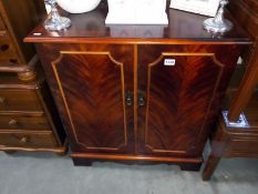 A dark wood stained 2 door cupboard with inner drawer. 79cm x 47cm x height 88cm. COLLECT ONLY.