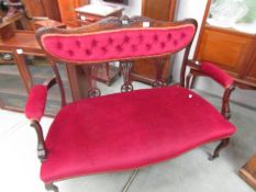 A mahogany framed two seat settee. COLLECT ONLY.