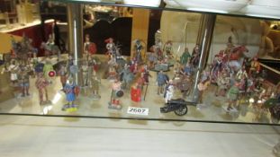 57 Lead and metal miniature figures including some on horses.