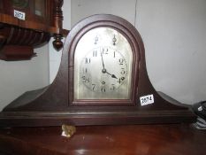 A mantel clock with silvered dial in working order. COLLECT ONLY.