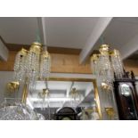 Two 24ct gold plated Swaroski crystal chandeliers and four matching wall lights. COLLECT ONLY.