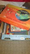 A quantity of vintage board games including Escolado, Waddingtons Thunderbirds game, Scrabble etc.,