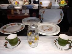 A quantity of Pyrex style dinner plates, Biltons Staffordshire cups & saucers etc.