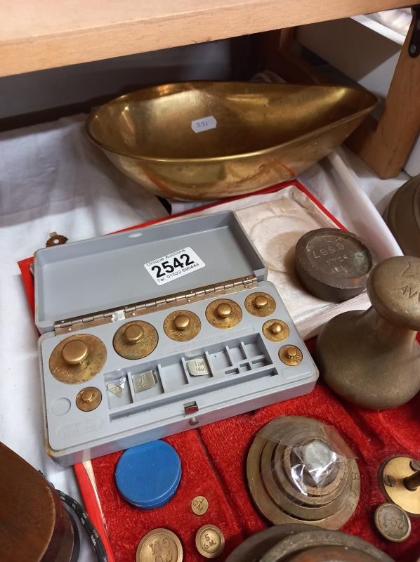 A cased set of scales, a quantity of weights and a brass scale pan. - Image 2 of 3