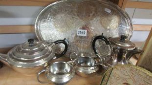 A three piece silver plated tea set, tray and water jug. (EPBM)