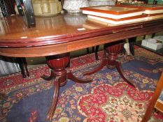 An oval mahogany twin pedestal dining table, COLLECT ONLY.