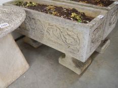 A garden planter with decoration on sides, 17 x 80 x 44 cm high. COLLECT ONLY.