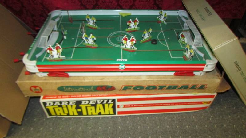 A boxed Munro International football game and a vintage Subbuteo table cricket, unchecked. COLLECT