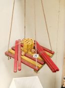 A wooden vintage child's swing with extras to build up sides