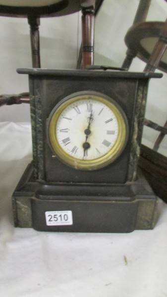 A heavy black slate mantel clock, COLLECT ONLY.