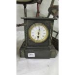 A heavy black slate mantel clock, COLLECT ONLY.