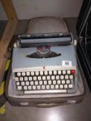 A vintage cased Brother de-luxe typewriter
