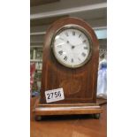 An Edwardian mahogany inlaid mantel clock in working order.