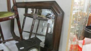 An oak framed bevel edged mirror. COLLECT ONLY.