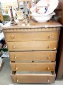 A well made teak style 5 drawer chest