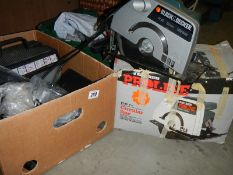 A box of carpet cleaner parts and an electric 8" saw.