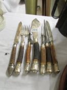 A selection of hall marked silver mounted carving implements in good condition.