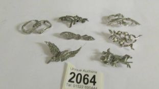 Seven marcasite brooches including some silver.