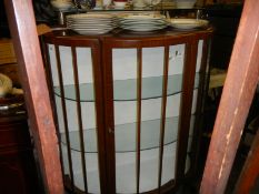 A bow front display cabinet, 106 cm wide x 42 cm deep maximum, x 115 cm high, COLLECT ONLY.