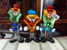 Three Venetian glass clowns,