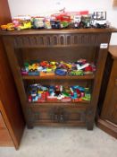 A rustic oak bookcase with cupboard doors 66cm x 29cm x 89cm high COLLECT ONLY