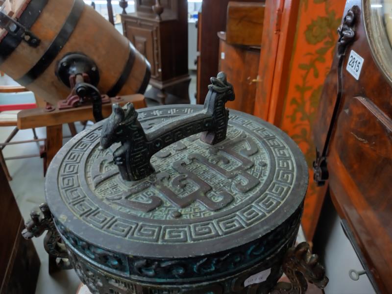 A Chinese lidded cauldron on three feet. - Image 2 of 4