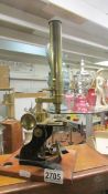 A good quality brass microscope.