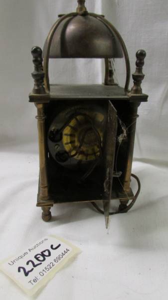 An old electric brass lantern clock. - Image 2 of 2