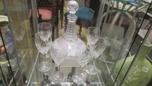 A good quality cut glass ship's decanter and 6 glasses.
