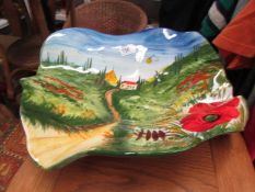 A large poppy decorated dish.