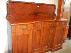 A Victorian mahogany break front sideboard with flame mahogany back panel, 153 wide x 55 cm deep,