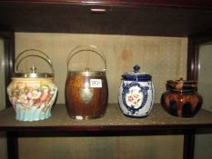 Three biscuit barrels and a tobacco jar.