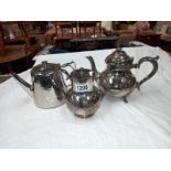 A silver plate teapot, silver plate water jug & an old stainless steel teapot