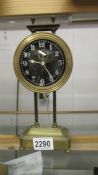 A Victorian brass Gravity clock, in working order.