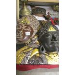 Two wooden Asian wall masks and a carved wood panel. COLLECT ONLY.