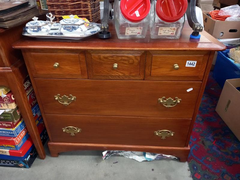 A teak 3 over 2 bedroom chest of drawers