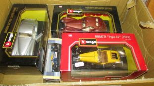 Three boxed Burago 1/24 scale Jaguar and Bugatti diecast models etc.,