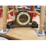 A Hermle chiming mantel clock.