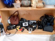 A good lot of camera's including a Canon T50, viewers, A Sony mini disc player , smart phones & Kobo