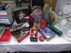 A selection of advertising tins including post-box moneybox etc
