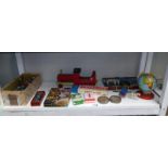 A shelf of vintage toys & games including plastic soldiers & marbles etc.
