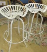 A pair of industrial tractor seat stools. COLLECT ONLY.