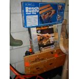 A portable folding saw bench, a Powell bench buddy in box and a Black & Decker jobber in box,
