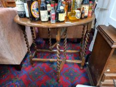 An oak barley twist gate leg table. COLLECT ONLY.