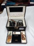 A jewellery box with key containing costume jewellery & watches