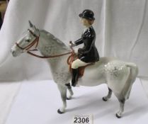 A Beswick horse with rider.